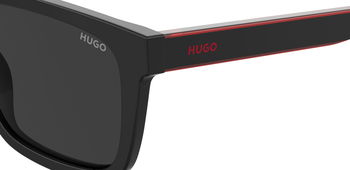 Das Bild zeigt die Sonnenbrille HG1297/S OIT von der Marke Hugo in rot/schwarz.