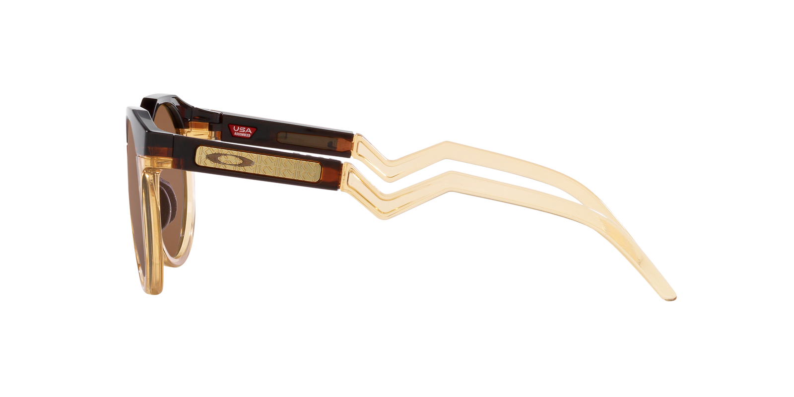 Das Bild zeigt die runde Sonnenbrille 9242 924207 Kylian Mbappé Signature Series für Herren von der Marke Oakley in beige braun transparent seitlich