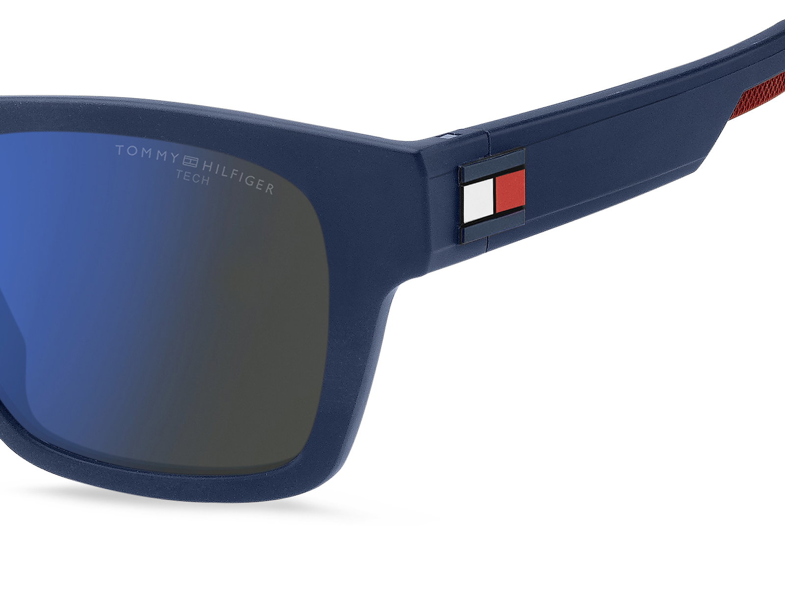 Das Bild zeigt die rechteckige Sonnenbrille TH 1975/S für Herren von der Marke Tommy Hilfiger in blau matt von rechts