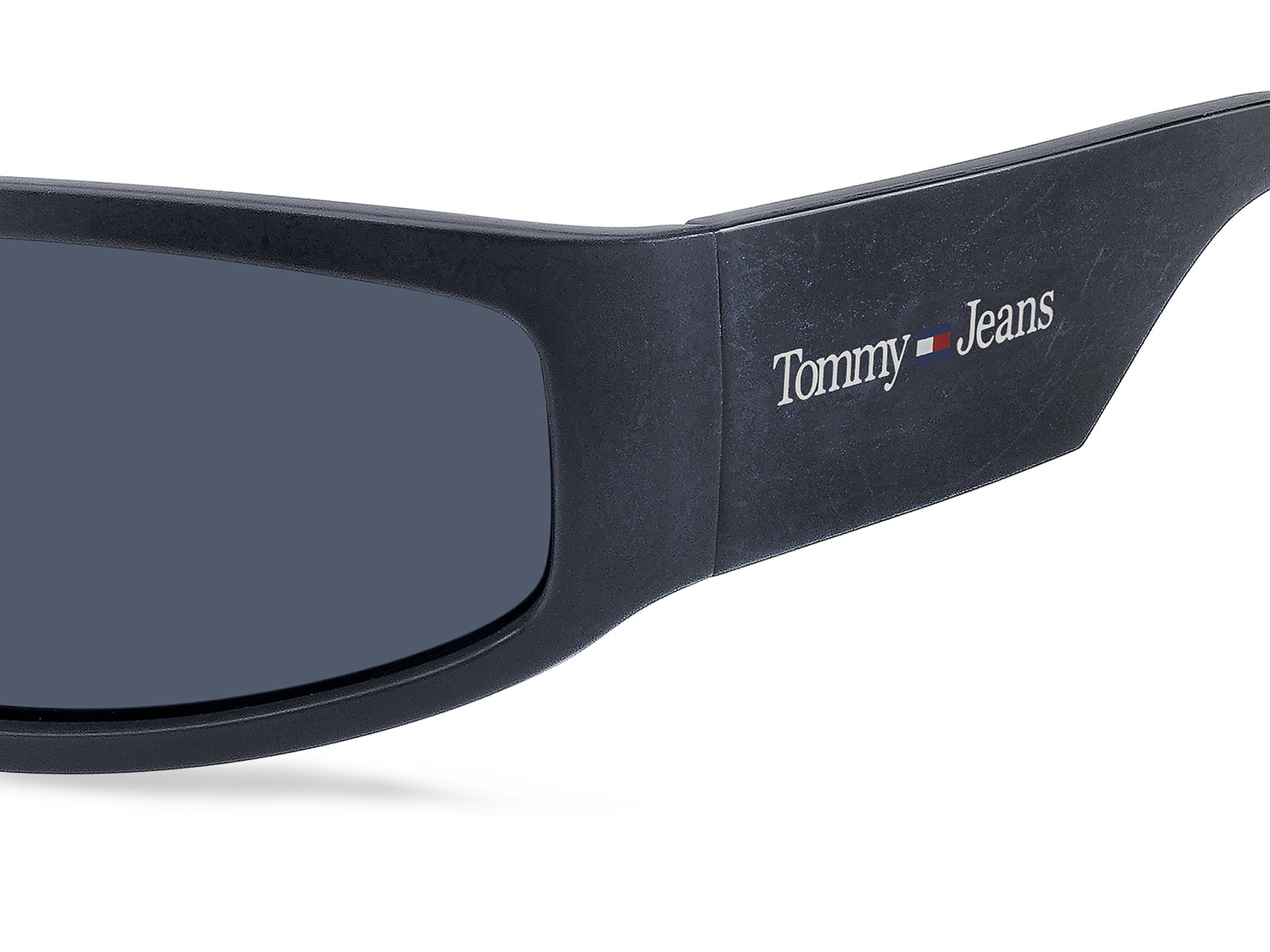 Das Bild zeigt die schmale Sonnenbrille TJ 0094/S IBD für Herren von der Marke Tommy Hilfiger in blau seitlich