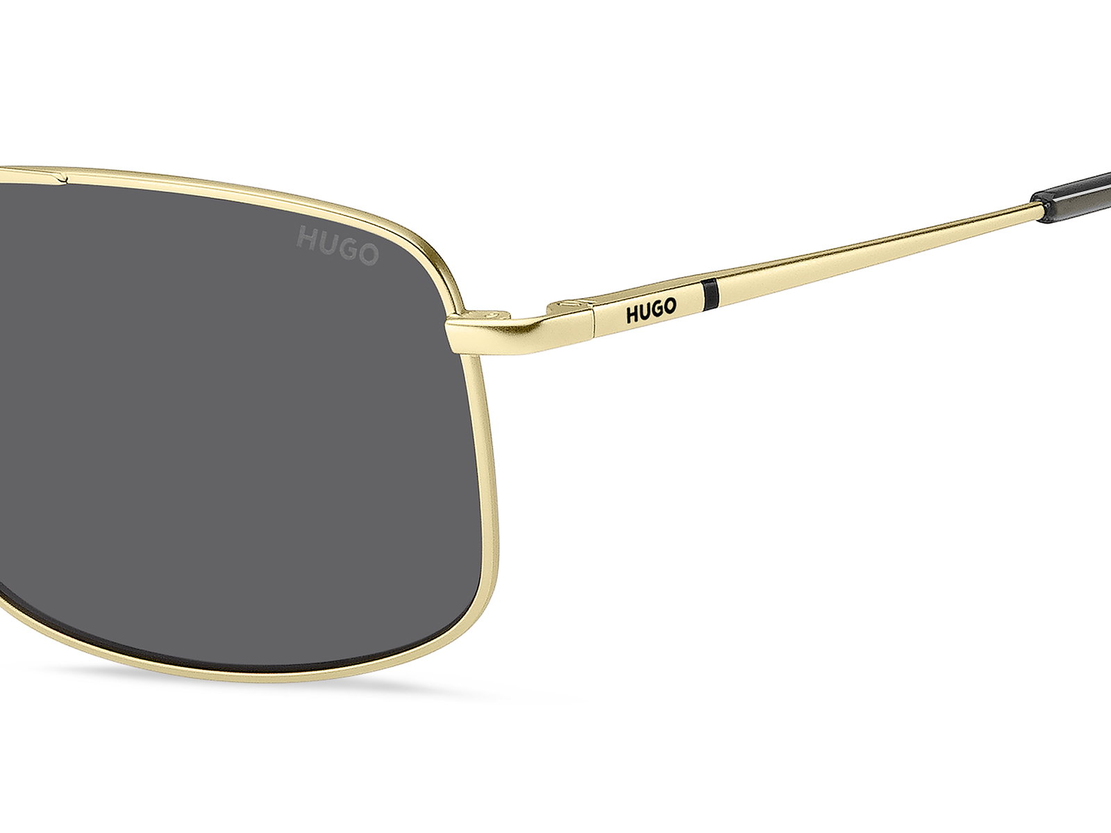 Das Bild zeigt die Sonnenbrille HG1287/S 2F7 von der Marke Hugo in gold/grau.